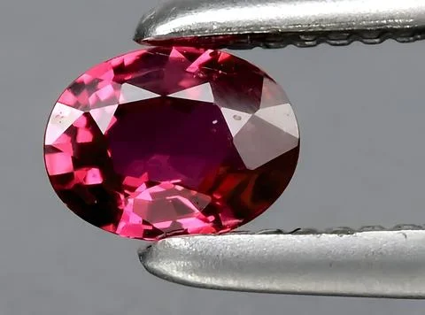 Natural red ruby gem on the background 写真素材