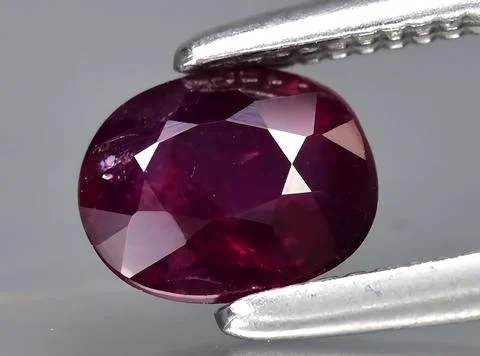 Natural red ruby gem on the background 库存照片