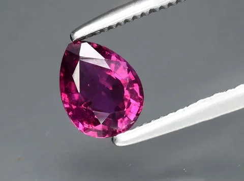Natural red ruby gem on the background 写真素材