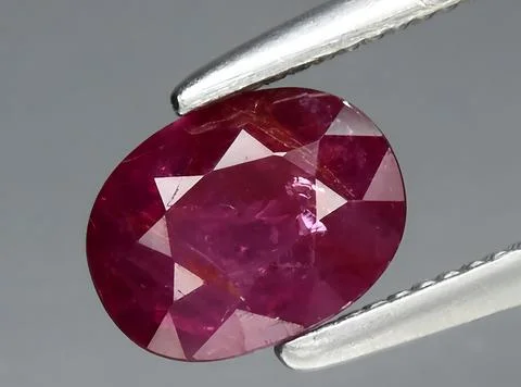 Natural red ruby gem on the background Stock Photos