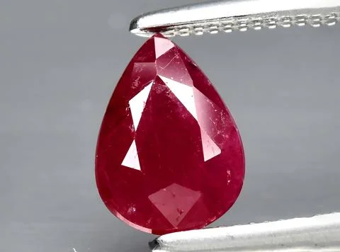 Natural red ruby gem on the background 写真素材