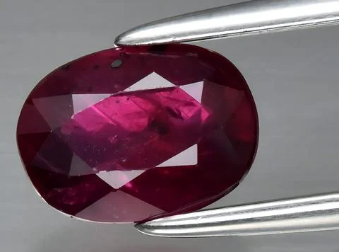 Natural red ruby gem on the background Stock Photos