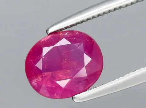 Natural red ruby gem on the background 写真素材