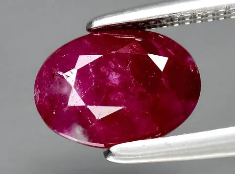 Natural red ruby gem on the background Stock Photos