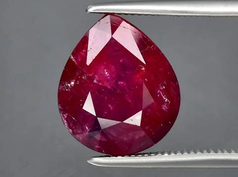 Natural red ruby gem on the background Stock Photos