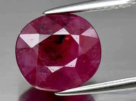Natural red ruby gem on the background 写真素材