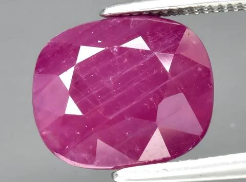 Natural red ruby gem on the background Stock Photos