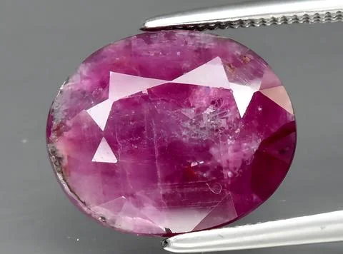 Natural red ruby gem on the background Stock Photos
