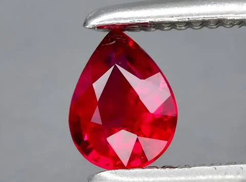 Natural red ruby gem on the background Stock Photos