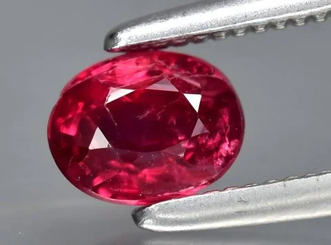 Natural red ruby gem on the background Stock Photos