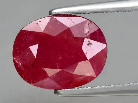 Natural red ruby gem on the background Stock Photos
