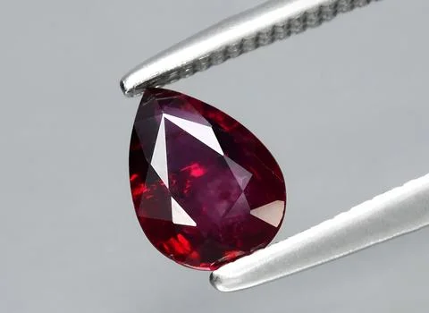 Natural red ruby gem on the background 写真素材