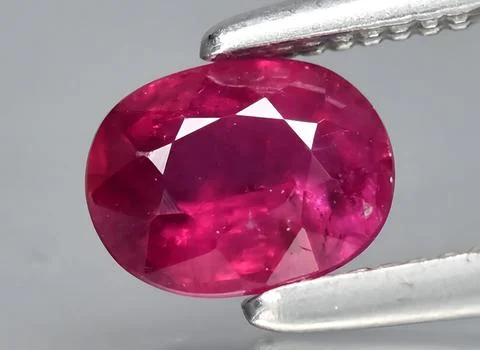 Natural red ruby gem on the background Stock Photos