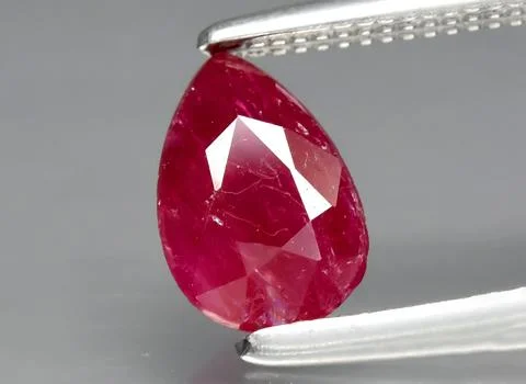 Natural red ruby gem on the background Stock Photos