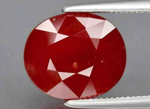 Natural red ruby gem on the background 写真素材