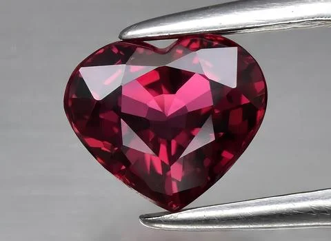 Natural red ruby gem on the background Stock Photos
