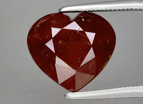 Natural red ruby gem on the background 写真素材