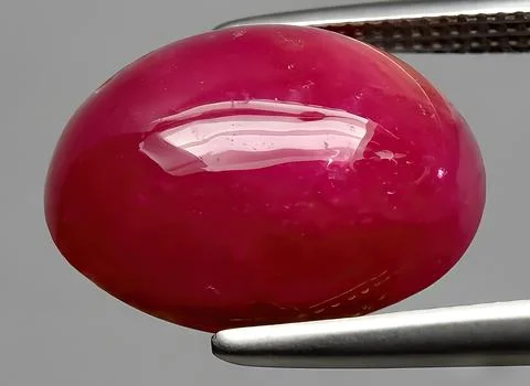 Natural red ruby gem on the background Stock Photos