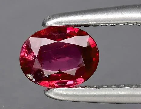 Natural red ruby gem on the background Stock Photos
