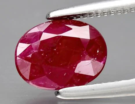 Natural red ruby gem on the background Stock Photos