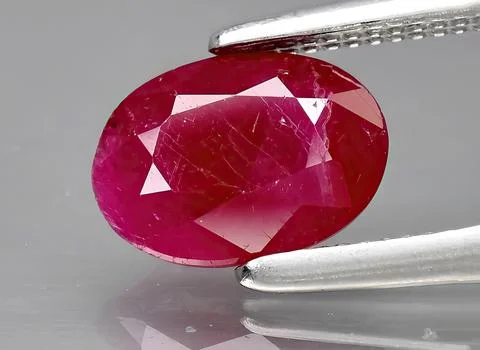 Natural red ruby gem on the background Stock Photos