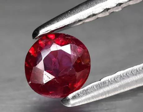 Natural red ruby gem on the background Stock Photos