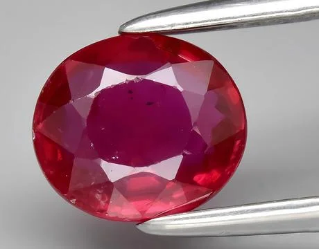 Natural red ruby gem on the background 写真素材