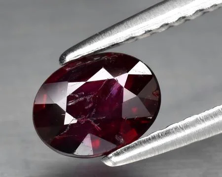 Natural red ruby gem on the background Stock Photos