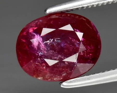 Natural red ruby gem on the background Stock Photos