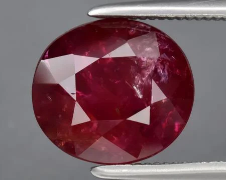 Natural red ruby gem on the background 写真素材