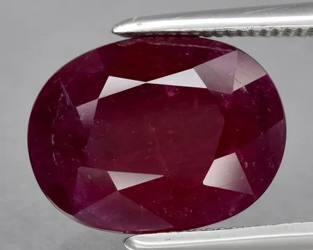 Natural red ruby gem on the background Stock Photos