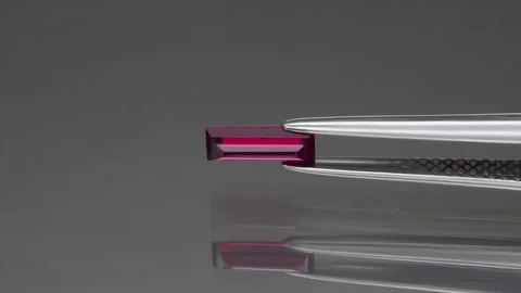 Natural red ruby on the grey background Stock Footage 145330659