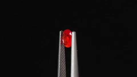 Natural red ruby sapphire on the turning table Stock Footage 176357962