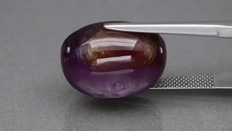 Natural red star ruby on the grey background Stock Footage 145436170