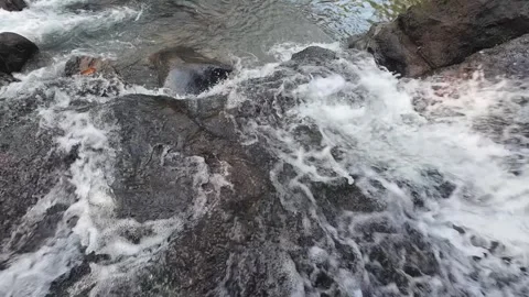 Natural River Cascade with Rushing Water Over Rocks in 4K Stock Footage 337309443