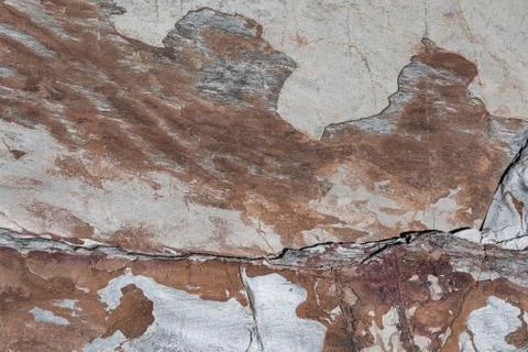 Natural rock background with abstract pattern drawn by nature. Stock Photos