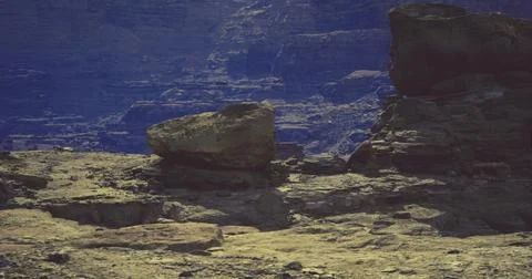 Natural rock formations create unique landscape in canyon during daylight Ilustração Stock
