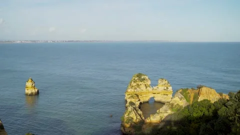 Natural rock formations in ocean seen from cliffs Video stock 273674436