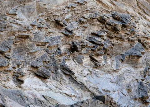 Natural rock with irregular surface with different shades. Stock Photos