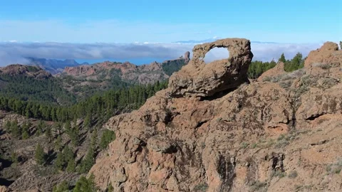 Natural Rock Window on a Ridge with Roque Nublo and Sea of Clouds, Ventana del Stock Footage 346803197