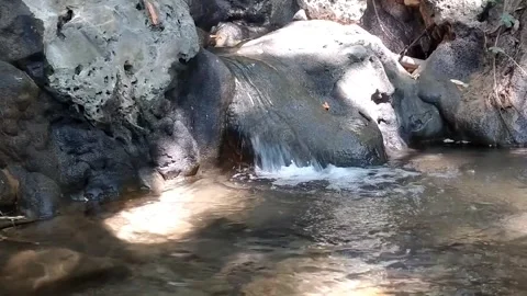 Natural Rocky Stream and Small Cave Stockbeeldmateriaal 340017211