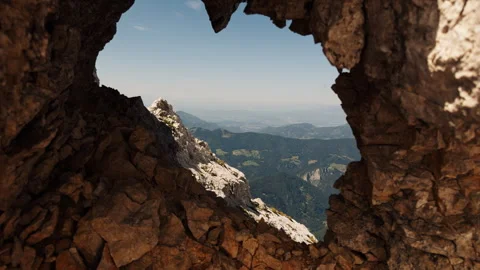 Natural Rocky Window Framing a Mountain View in the Alps Stock Footage 341318197