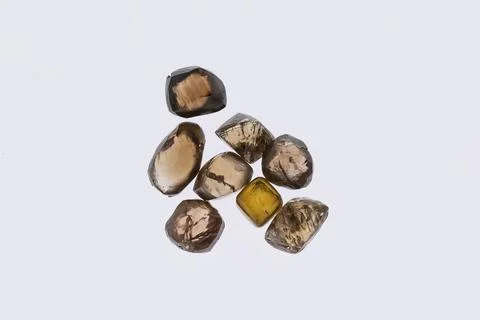 Natural rough diamonds in the sorting process close up Stock Photos