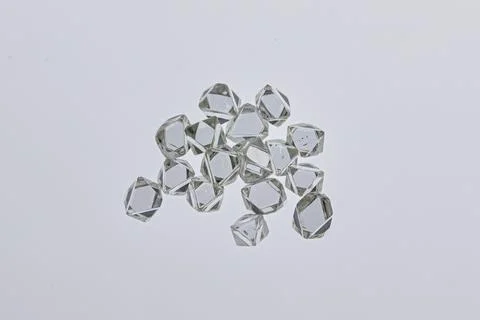 Natural rough diamonds in the sorting process close up Stock Photos
