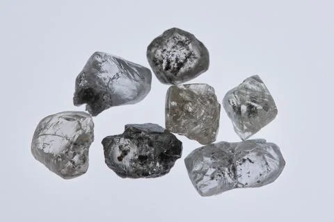 Natural rough diamonds in the sorting process close up Stock Photos