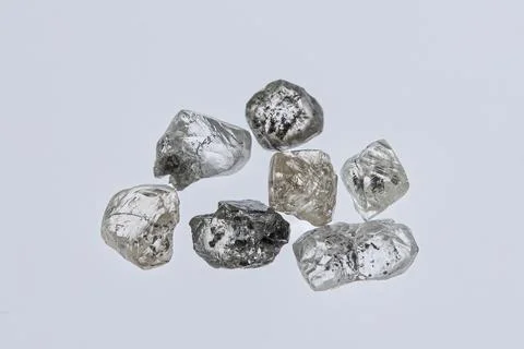 Natural rough diamonds in the sorting process close up Stock Photos