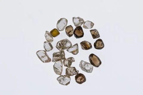 Natural rough diamonds in the sorting process close up Stock Photos