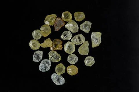 Natural rough diamonds in the sorting process close up Stock Photos