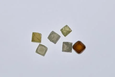 Natural rough diamonds in the sorting process close up Stock Photos