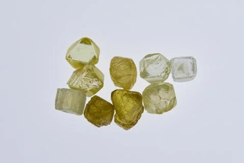 Natural rough diamonds in the sorting process close up Stock Photos
